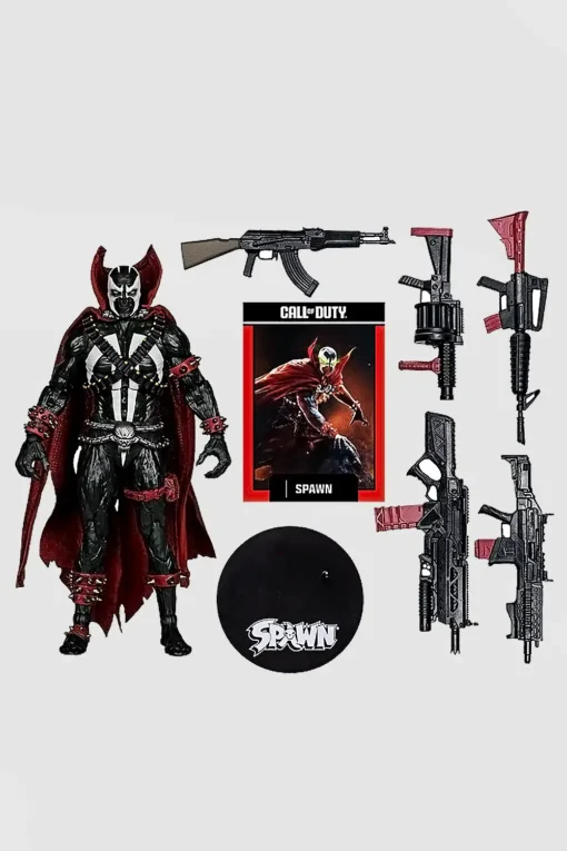 Action figure in black and white armor with a red cape, displayed with all its weapons and original packaging box.